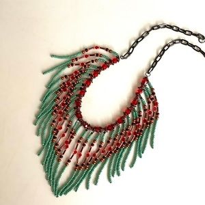 Beaded fringed handmade necklace in lime green with red crystals